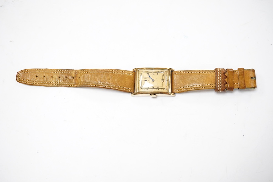 A gentleman's 1930's/1940's 14k gold Zenith manual wind wrist watch, with rectangular Arabic dial and subsidiary seconds, case diameter 25mm, on a later associated leather strap. Condition - fair